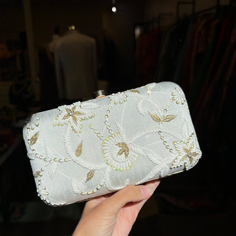 White embroidered clutch