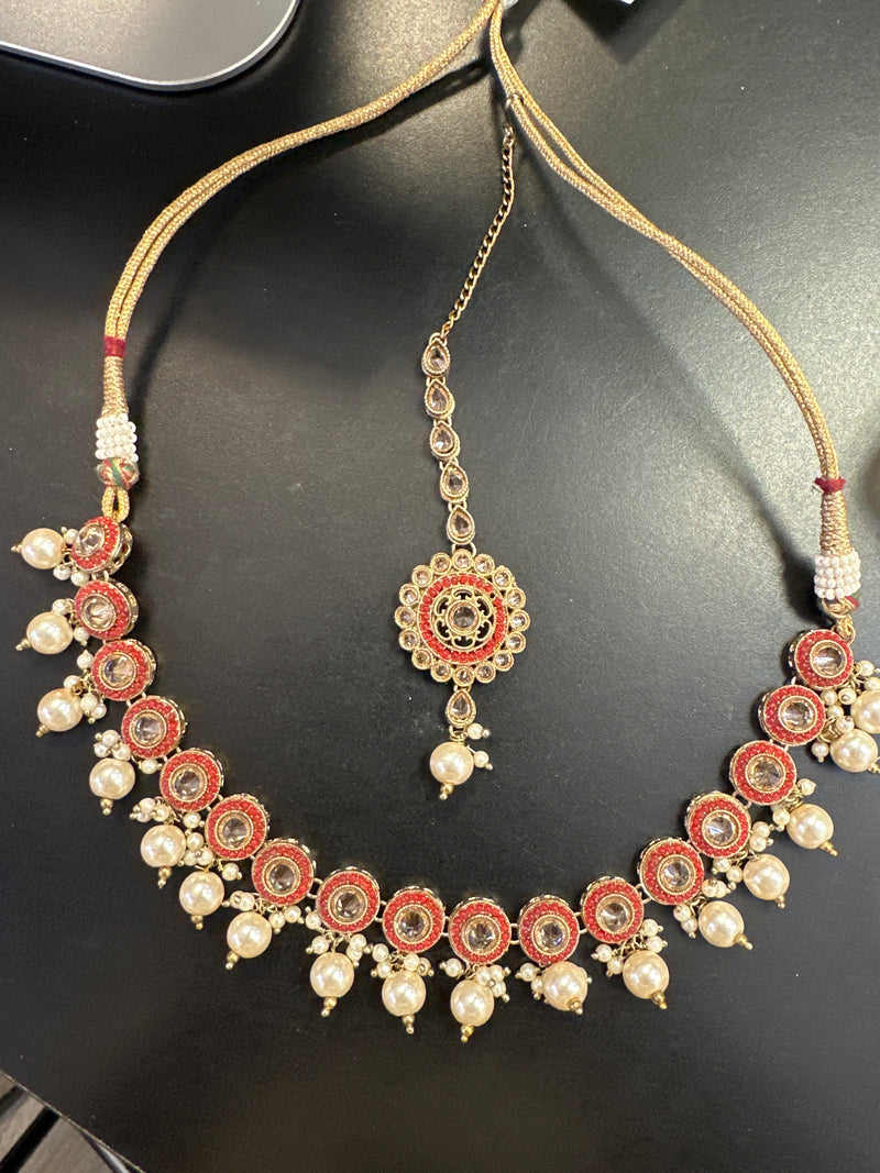 Red necklace and tikka